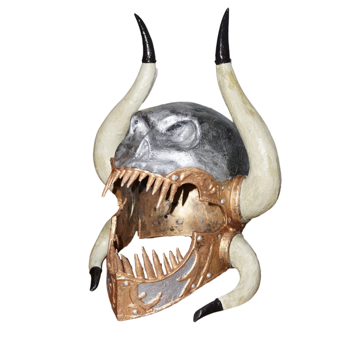 A skull-shaped object with sharp teeth and horns, possibly a decorative or artistic piece.